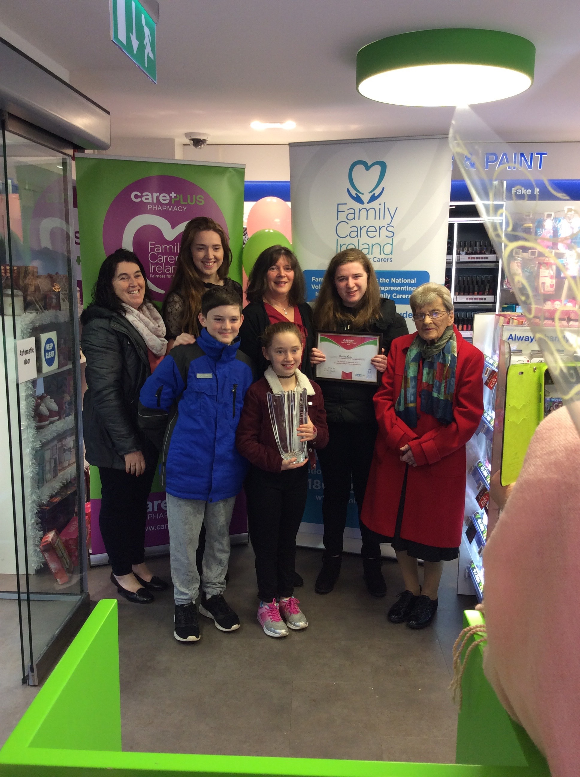 Adrienne Furey and her Family being awarded Galway Carer of the Year at Killian's CarePlus Pharmacy, Loughrea, Co. Galway