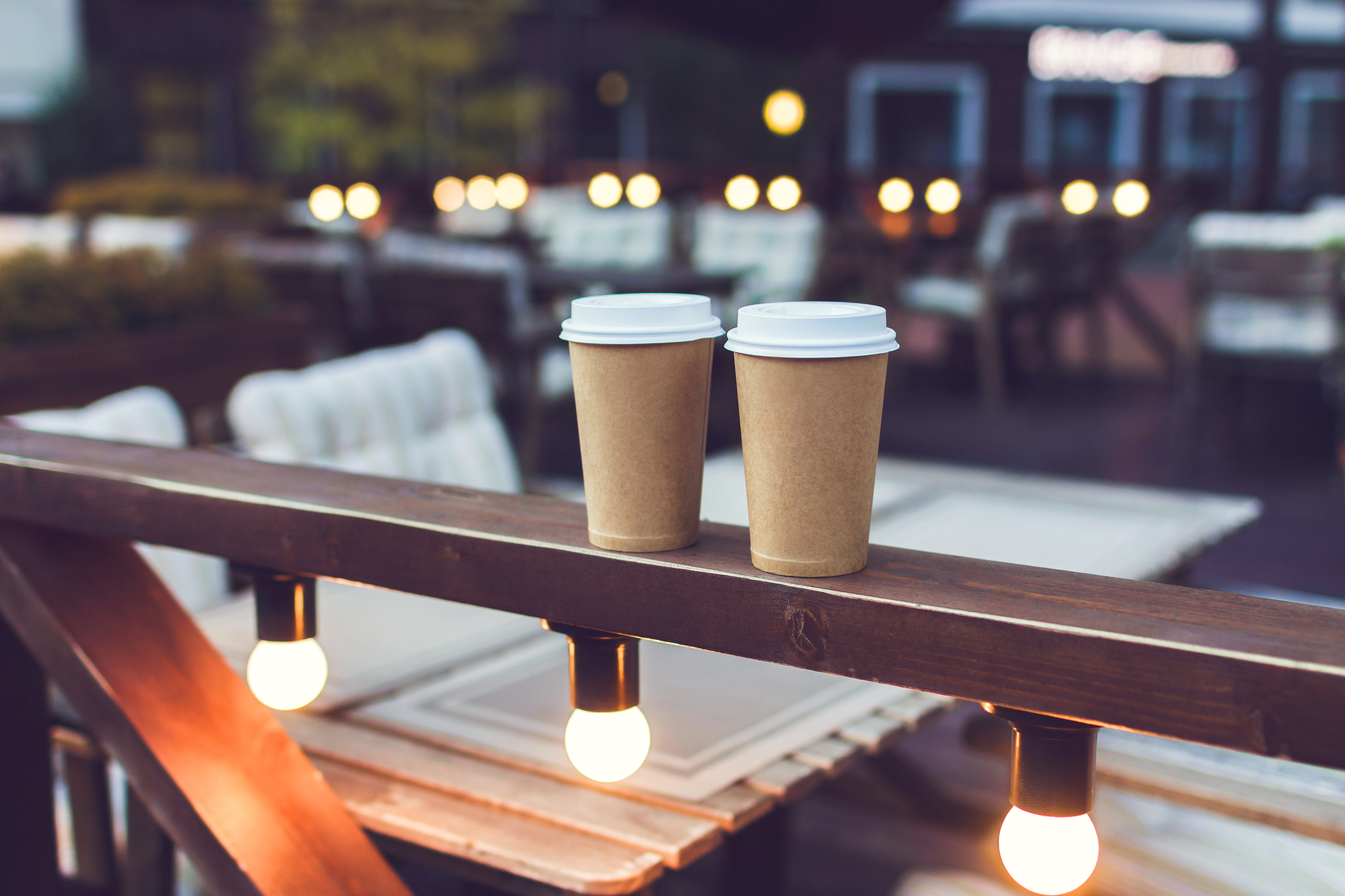 two takeaways coffees at a Christmas market